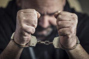 arrested-man-raising-fists