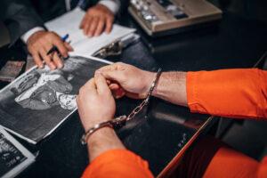 interrogating-handcuffed-man