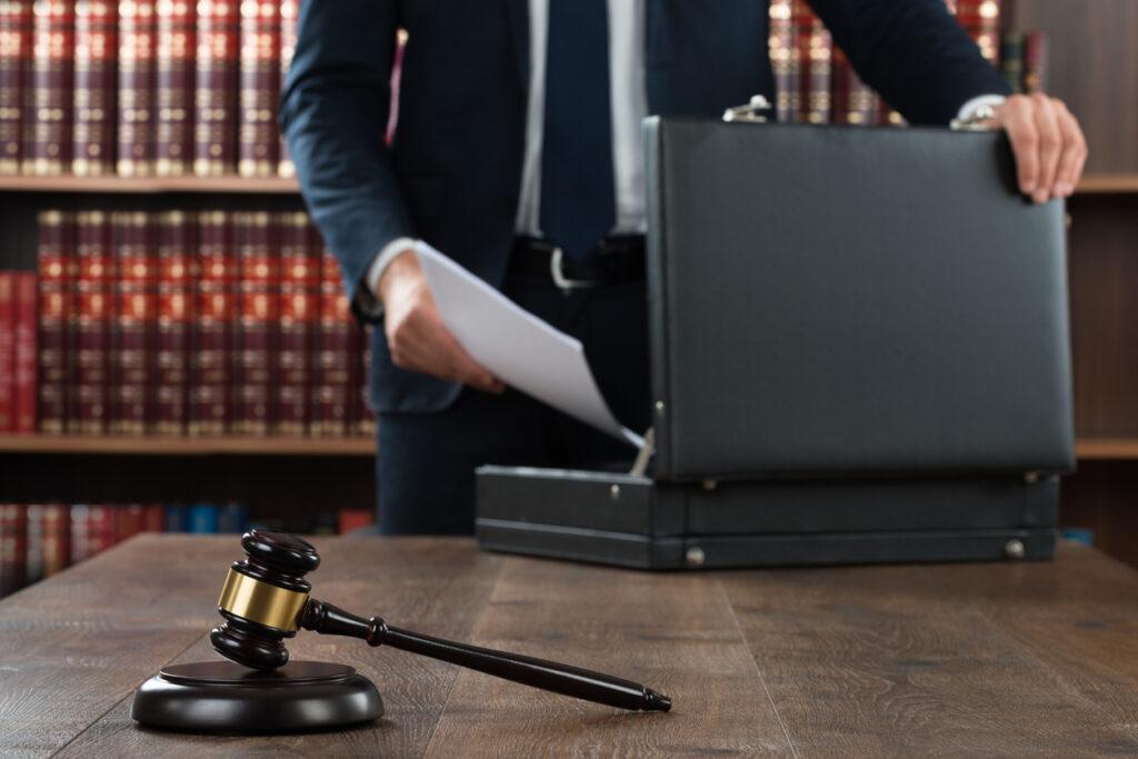 lawyer-putting-documents-in-briefcase