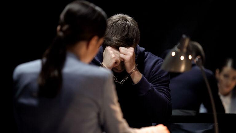 Handcuffed man getting probation from a jury for sexual assault charges.