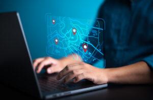 Man using a tracking device to locate someone on a computer.