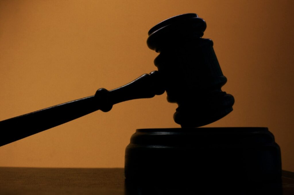 Close-up of a judge’s gavel in a Texas courtroom, symbolizing criminal justice decisions.