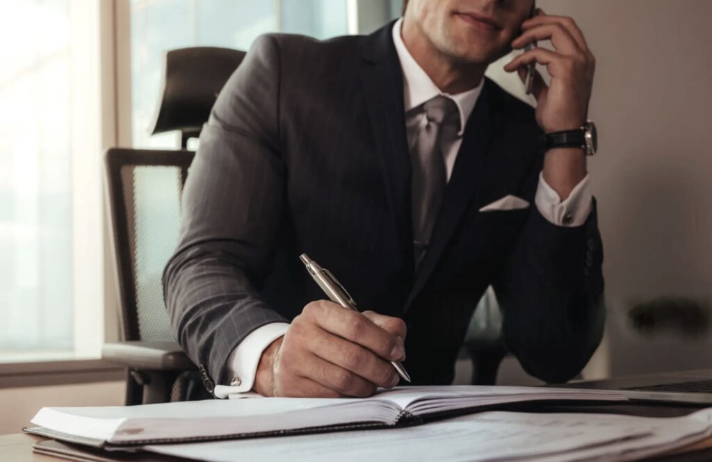 A Plano criminal defense attorney on the phone with a client who is in jail.