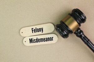 A simple chart comparing the long-term effects of a felony vs. a misdemeanor conviction in Texas.