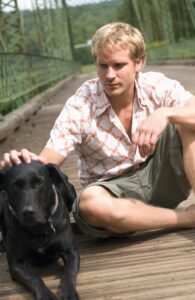 A worried pet owner with their dog, symbolizing the need for legal protection against animal seizure.