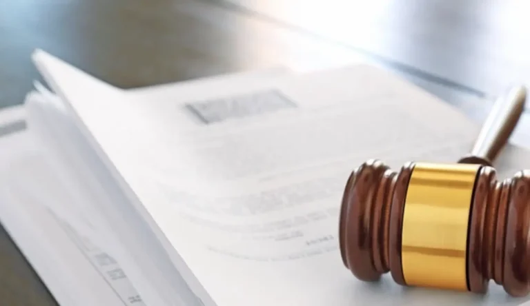 A judge's gavel on overturned legal documents, symbolizing a wrongful conviction being reversed.